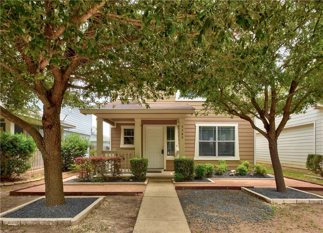 9309 Rowlands Sayle Road Austin, TX 78744 - Photo 1 of 1 a front view of a house with garden