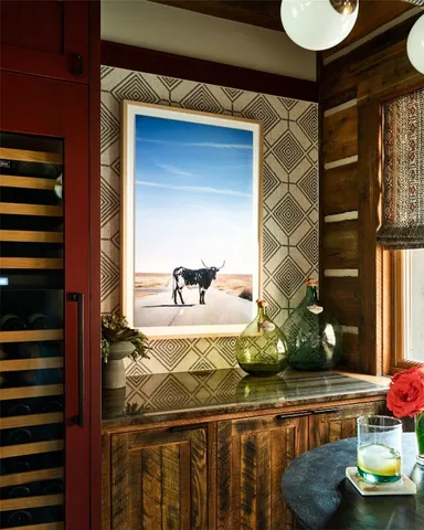 a living room with furniture and floor to ceiling windows