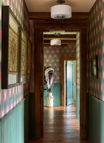 a bedroom with a bed couch and a large window