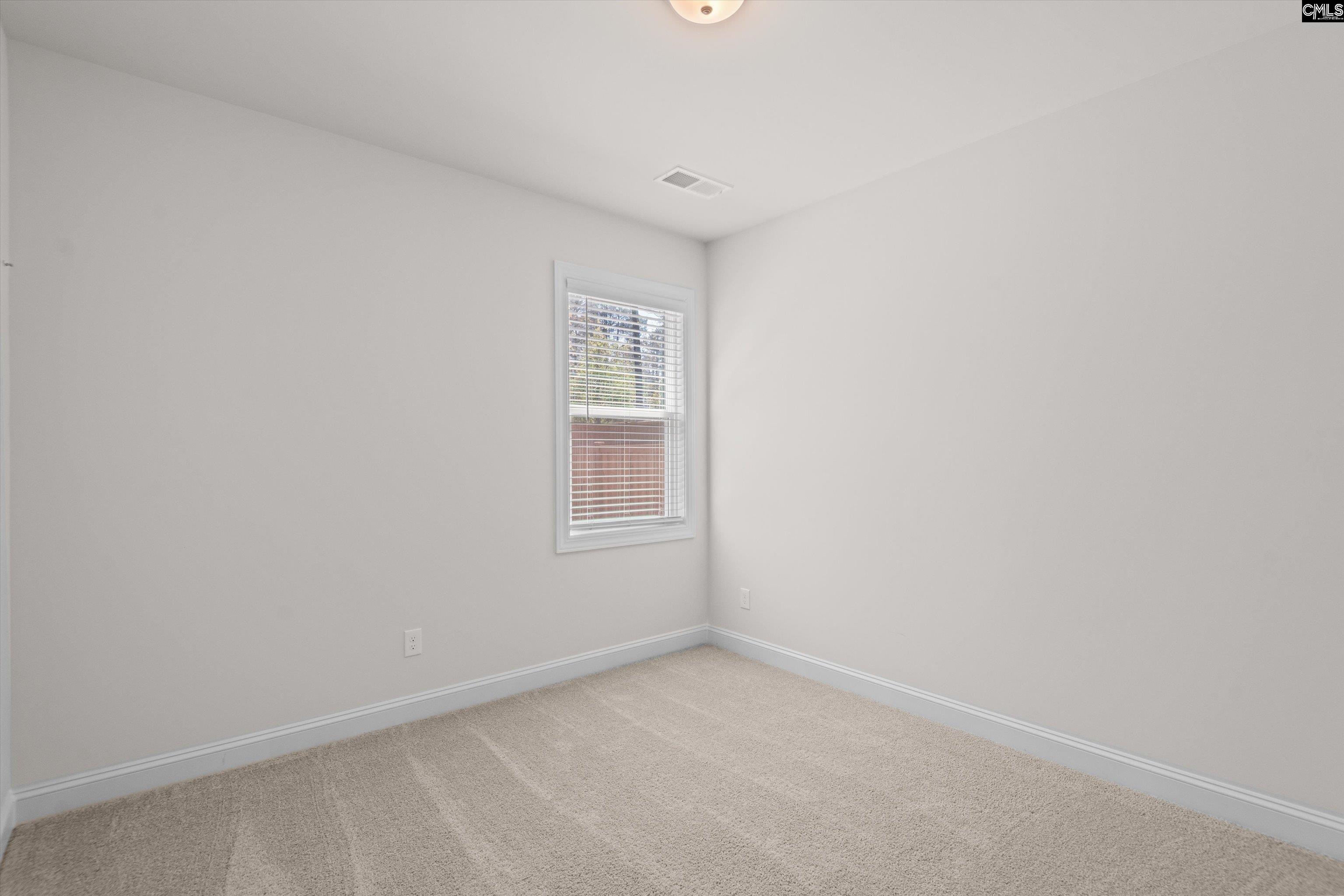 558 Wild Ginger Loop Irmo, SC 29063 - Photo 26 of 42 a view of an empty room with a window