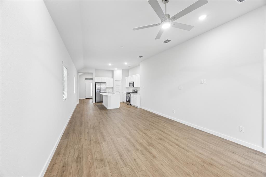 1322 Capecastle Lane Forney, TX 75126 - Photo 13 of 31 a view of empty room with wooden floor
