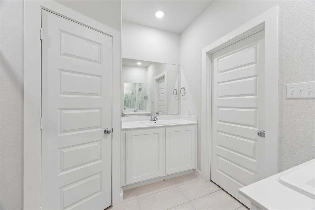 1322 Capecastle Lane Forney, TX 75126 - Photo 20 of 31 a bathroom with a shower and a sink