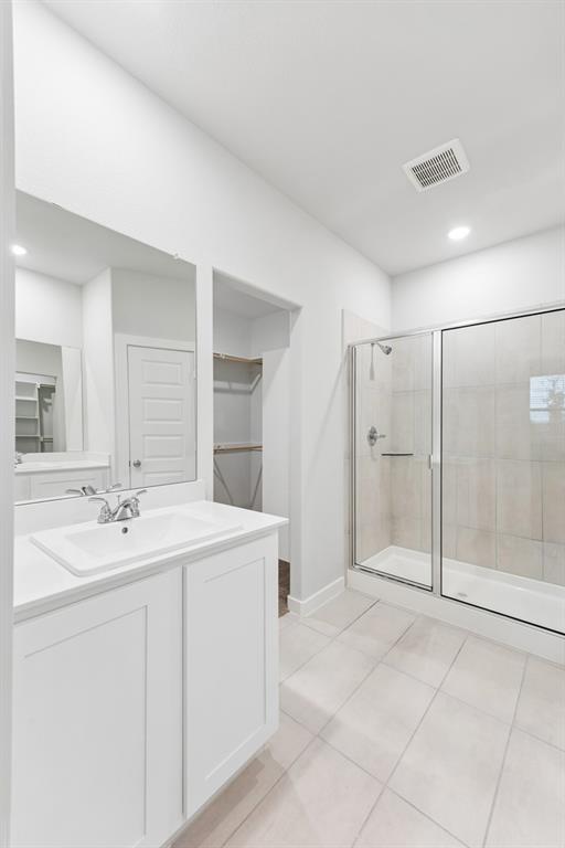 1322 Capecastle Lane Forney, TX 75126 - Photo 21 of 31 a bathroom with a shower sink and mirror