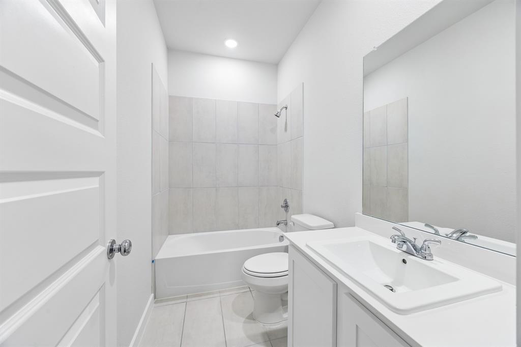 1322 Capecastle Lane Forney, TX 75126 - Photo 25 of 31 a bathroom with a sink a toilet and shower