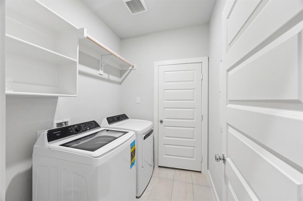 1322 Capecastle Lane Forney, TX 75126 - Photo 26 of 31 a utility room with dryer and washer