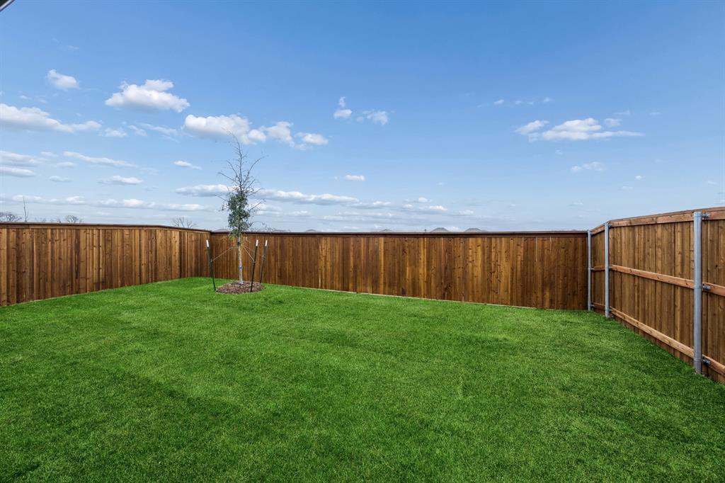 1322 Capecastle Lane Forney, TX 75126 - Photo 31 of 31 a view of a backyard with barn