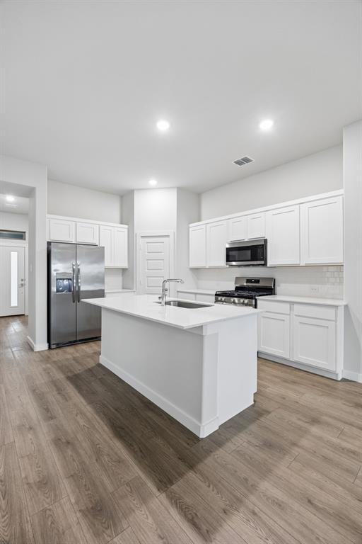 1322 Capecastle Lane Forney, TX 75126 - Photo 6 of 31 a view of kitchen with granite countertop stainless steel appliances