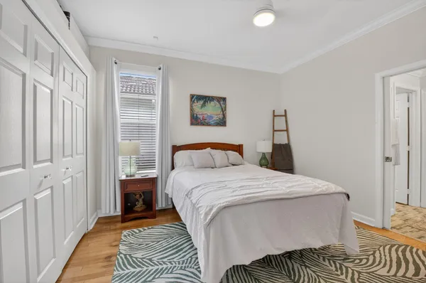 a bedroom with a bed and a couch