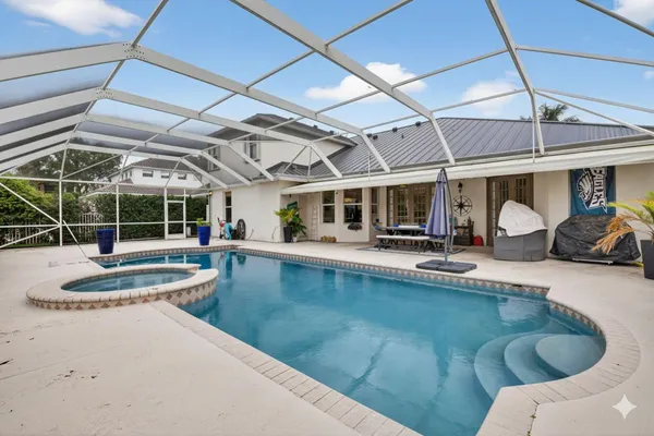 a view of a swimming pool with a patio