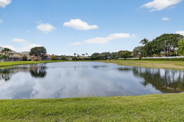 a view of a lake with houses in the back