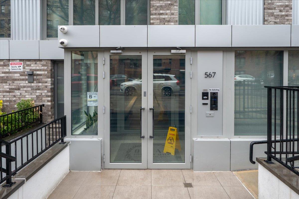 a view of a house with backyard and porch