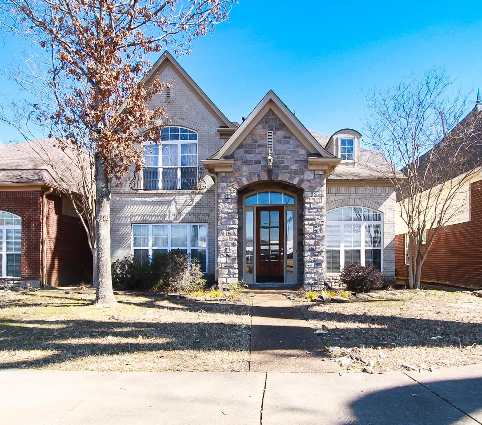 1818 North Houston Levee Road Cordova, TN 38016 - Photo 1 of 16 a front view of a house with a yard