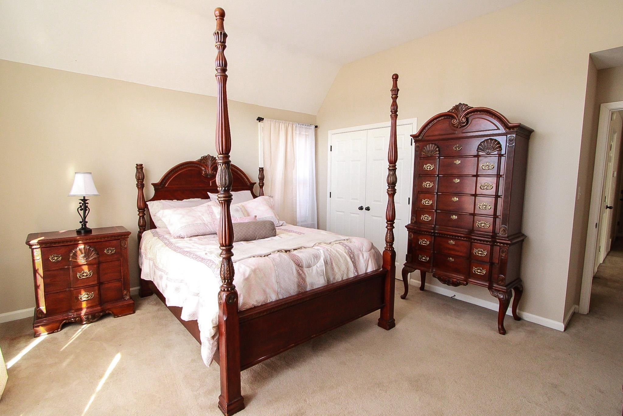 1818 North Houston Levee Road Cordova, TN 38016 - Photo 11 of 16 a bedroom with a bed and a dresser in it