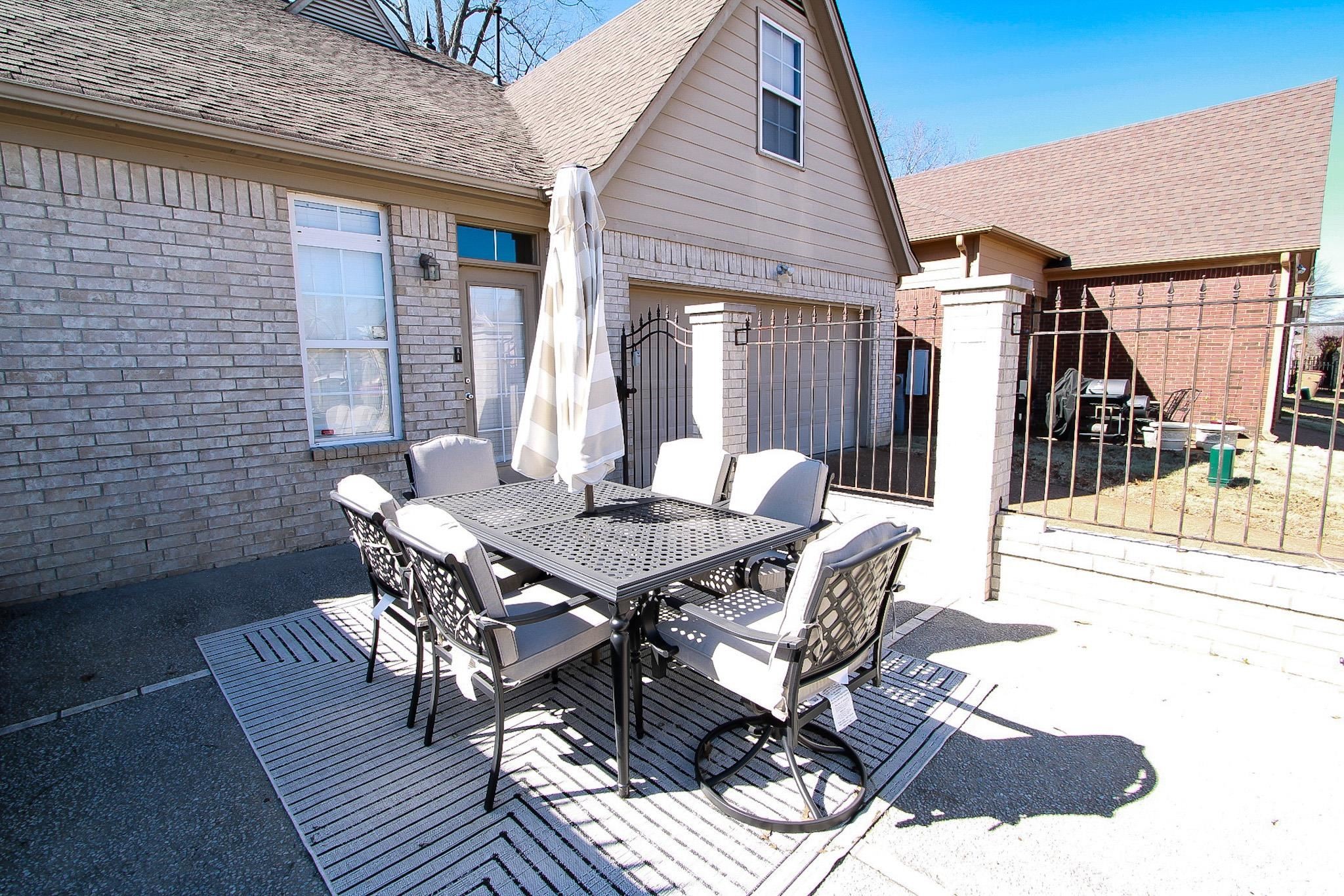1818 North Houston Levee Road Cordova, TN 38016 - Photo 14 of 16 a view of a patio with table and chairs and potted plants