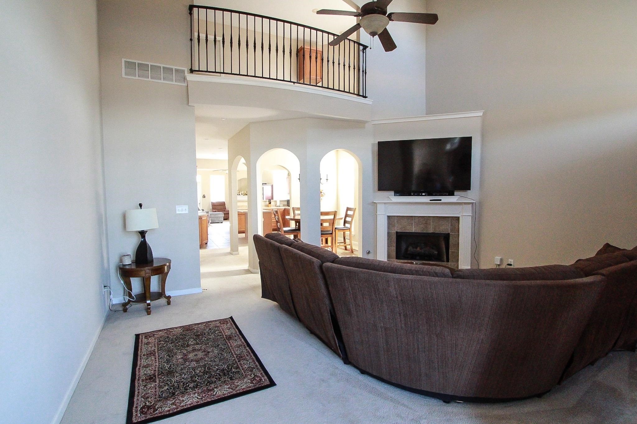 1818 North Houston Levee Road Cordova, TN 38016 - Photo 2 of 16 a living room with furniture and a fireplace