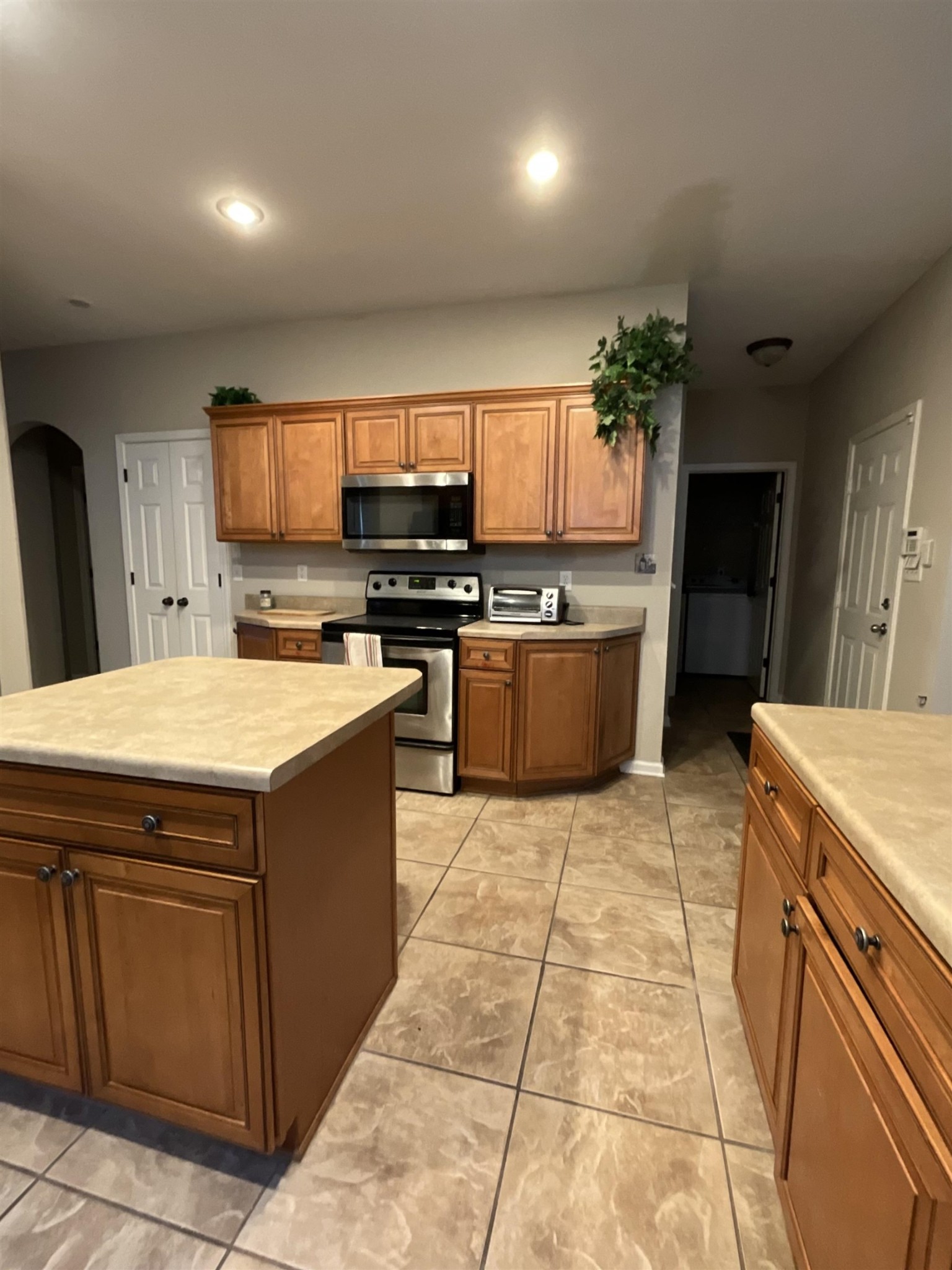 1818 North Houston Levee Road Cordova, TN 38016 - Photo 5 of 16 a kitchen with stainless steel appliances granite countertop a stove a sink dishwasher and a refrigerator