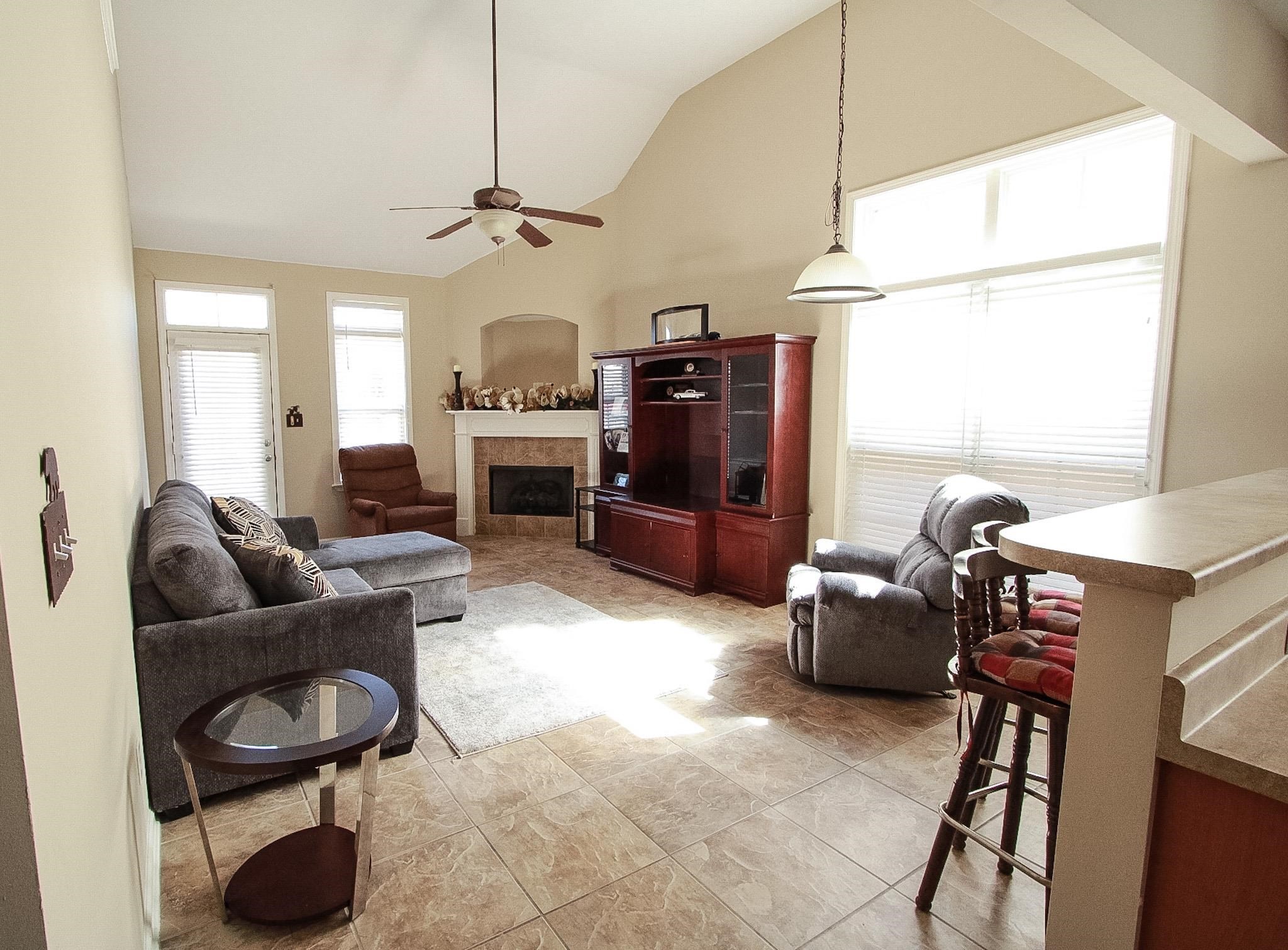 1818 North Houston Levee Road Cordova, TN 38016 - Photo 7 of 16 a living room with furniture a ceiling fan and a window