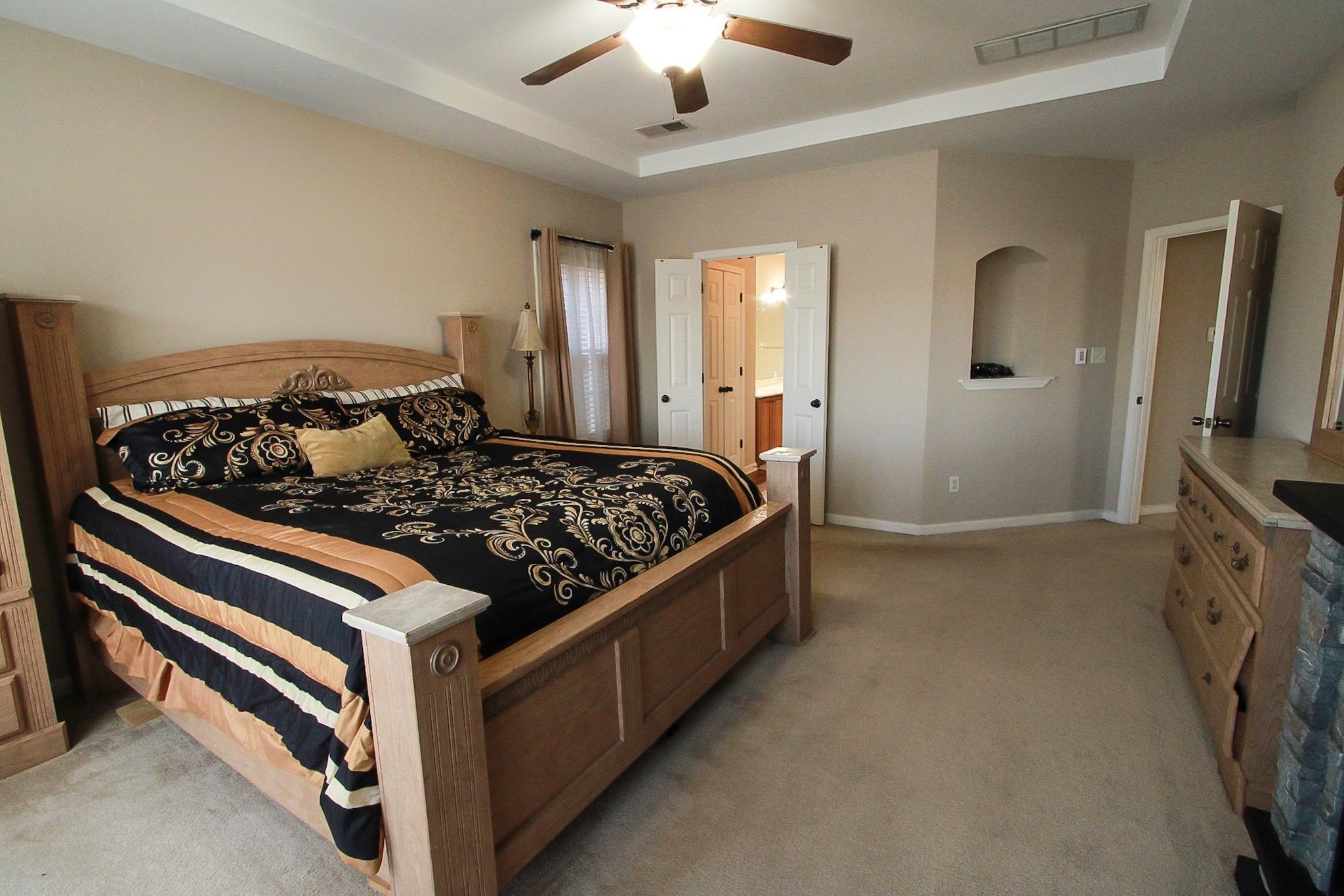 1818 North Houston Levee Road Cordova, TN 38016 - Photo 10 of 16 a bed room with a bed and a television
