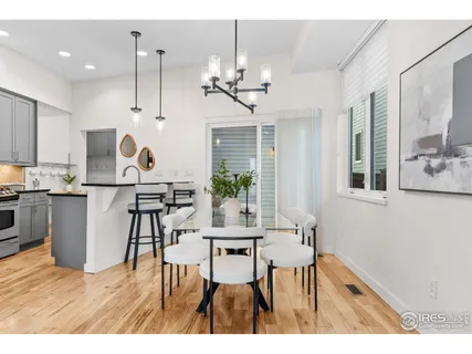 a kitchen with kitchen island granite countertop a sink stove and cabinets