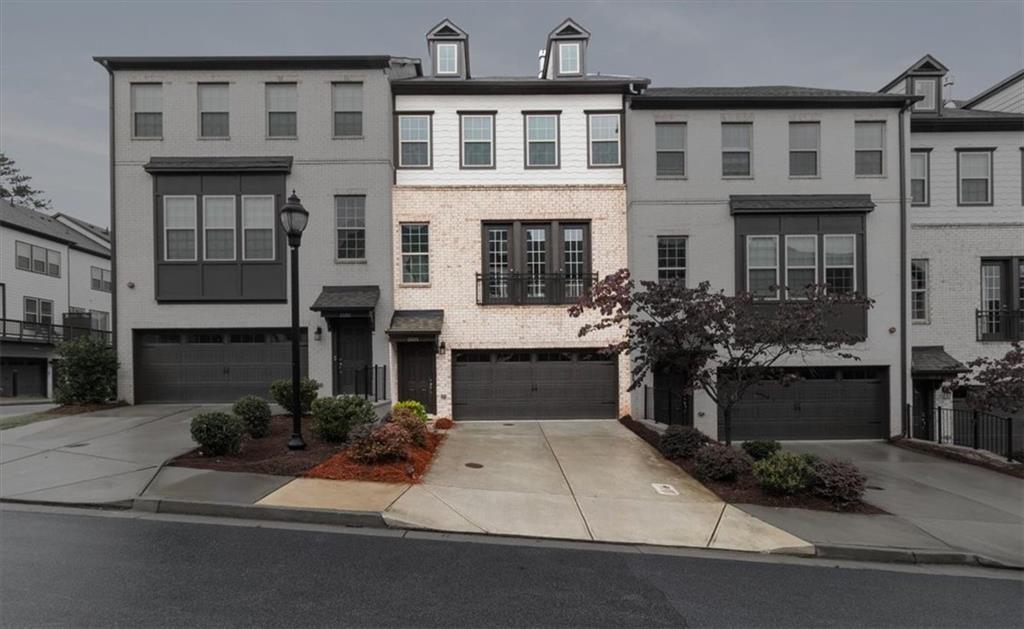 a front view of a house with yard