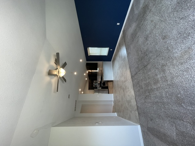 12401 Amber Lynn Path Manor, TX 78653 - Photo 8 of 33 High ceilings and recessed lighting illuminate this home's versatile interior.