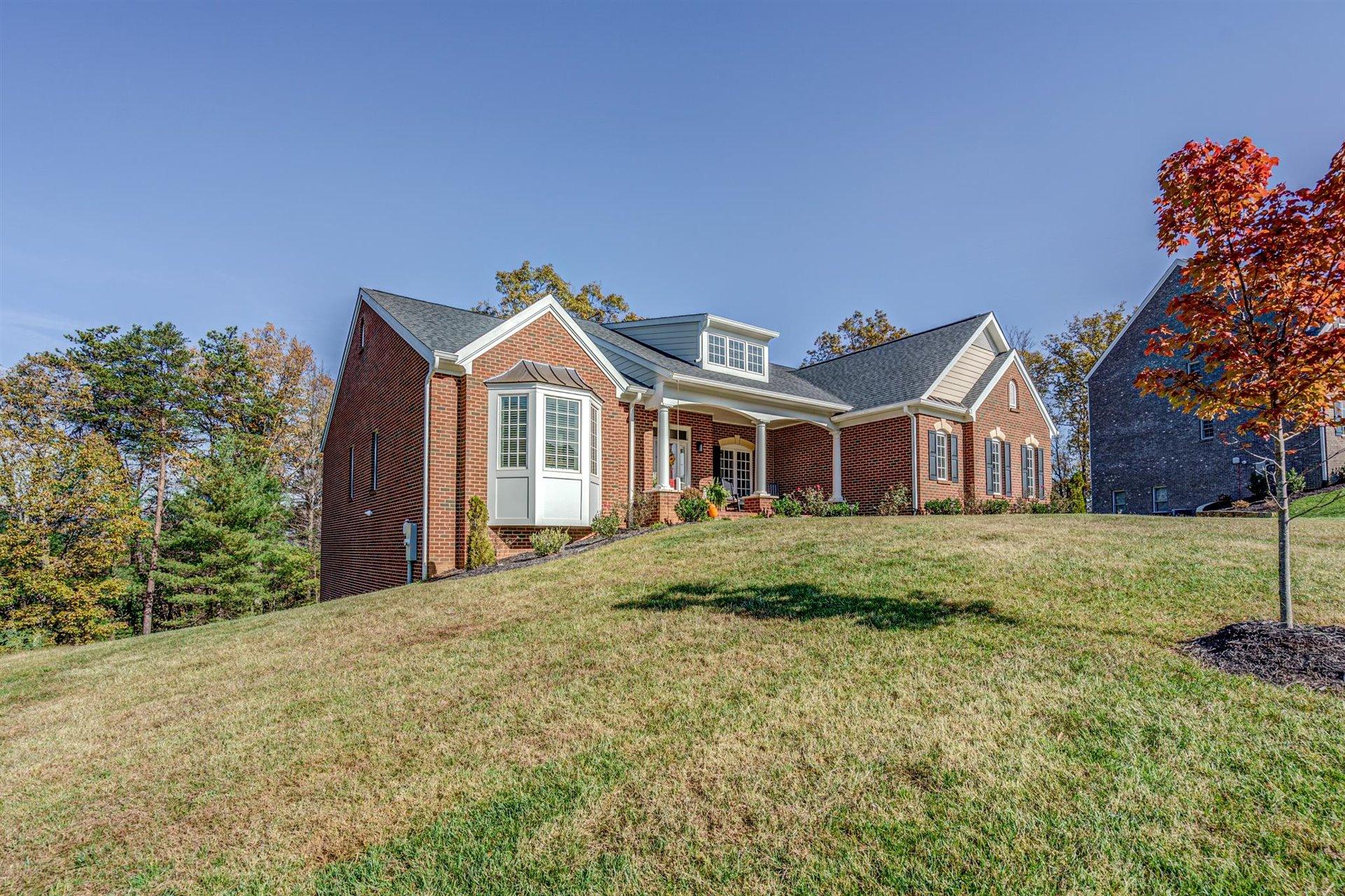 6989 Fairway Ridge Road Salem, VA 24153 - Photo 2 of 51 a front view of a house with a garden