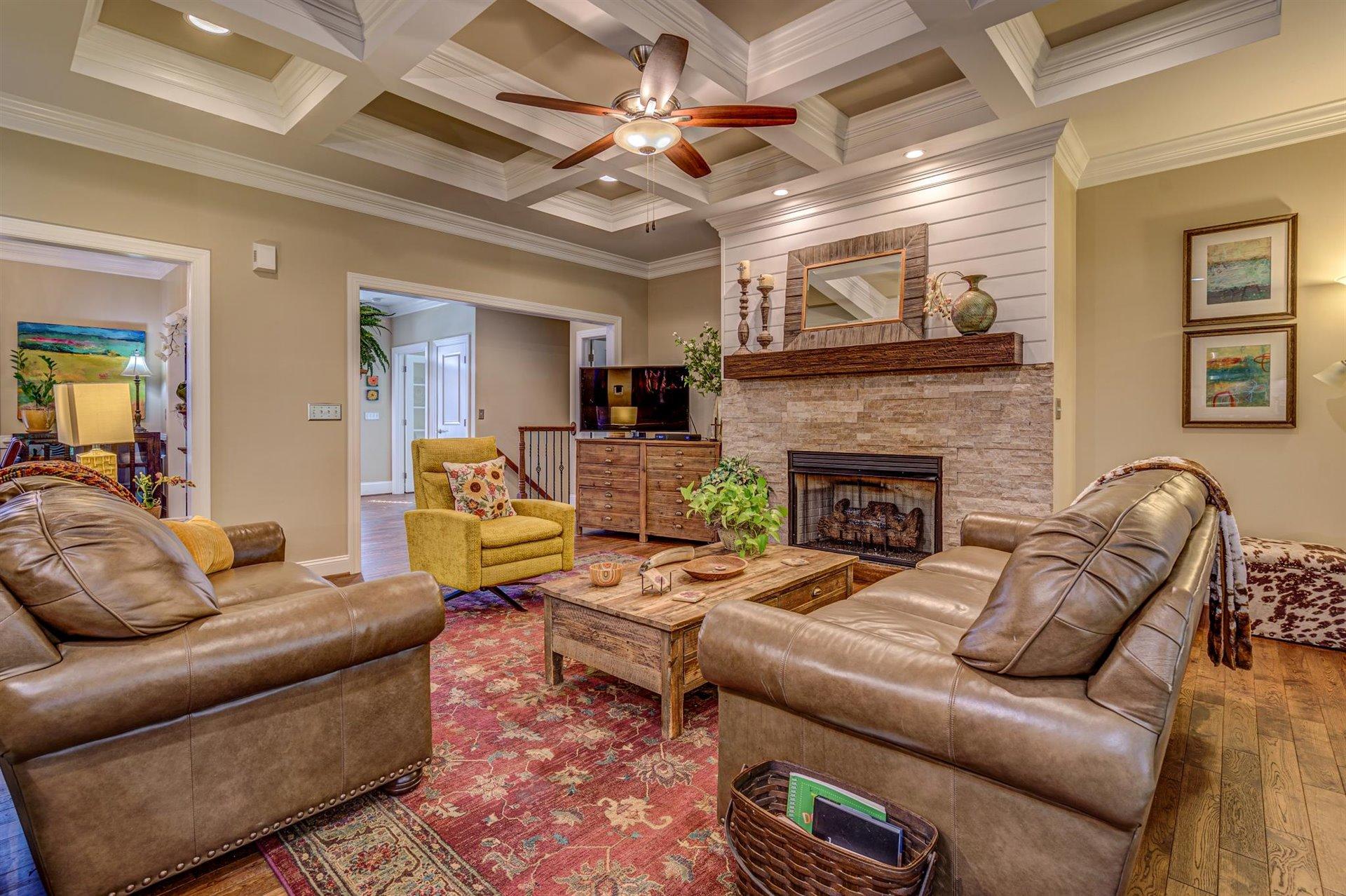 6989 Fairway Ridge Road Salem, VA 24153 - Photo 15 of 51 a living room with furniture a fireplace and a ceiling fan