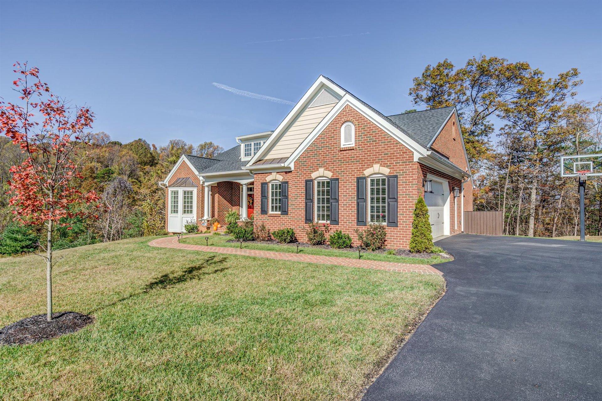 6989 Fairway Ridge Road Salem, VA 24153 - Photo 3 of 51 a front view of a house with a yard
