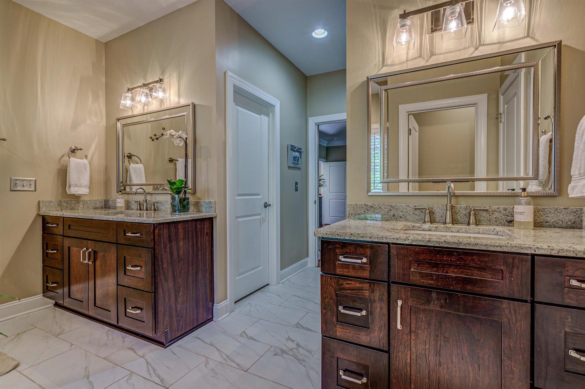 6989 Fairway Ridge Road Salem, VA 24153 - Photo 25 of 51 a bathroom with a granite countertop sink and a mirror