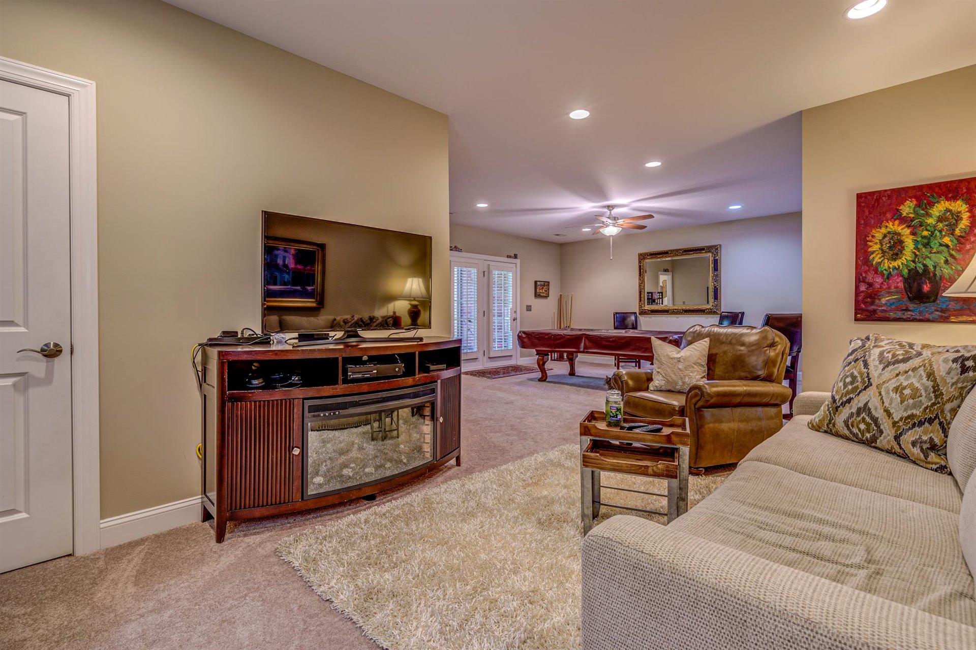 6989 Fairway Ridge Road Salem, VA 24153 - Photo 36 of 51 a living room with furniture and a flat screen tv