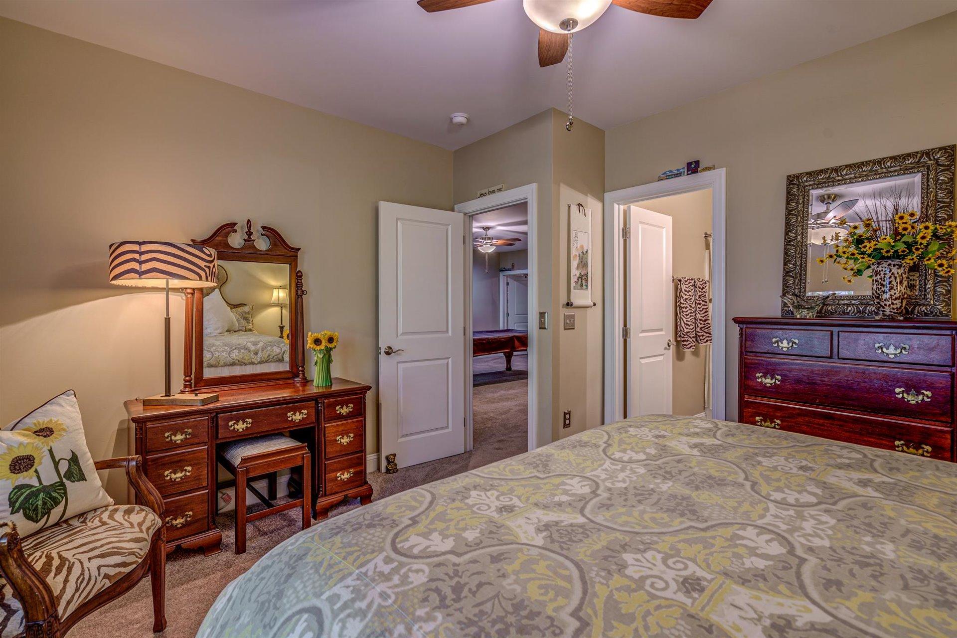 6989 Fairway Ridge Road Salem, VA 24153 - Photo 41 of 51 a bedroom with a bed and a dresser in it
