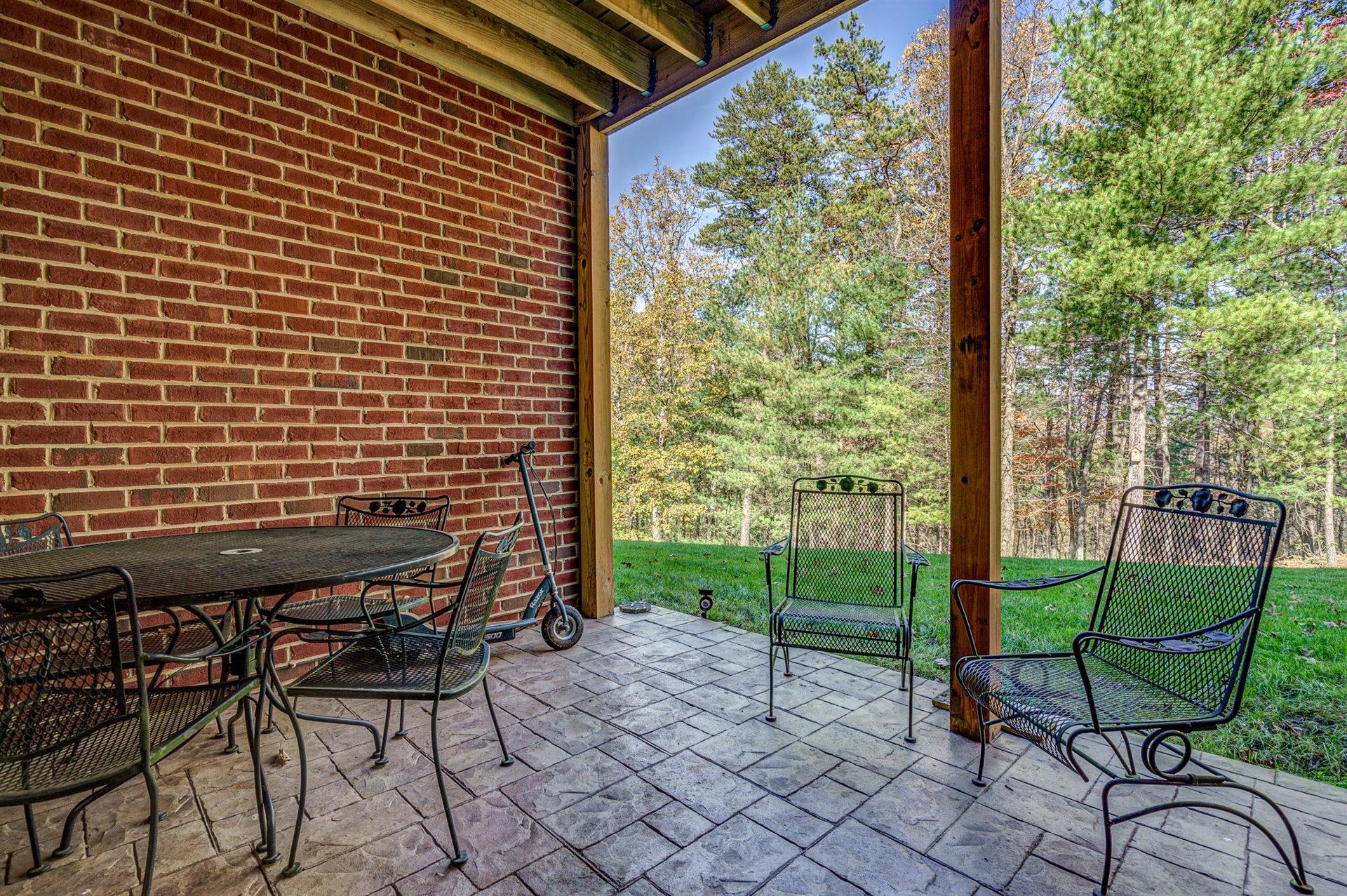 6989 Fairway Ridge Road Salem, VA 24153 - Photo 47 of 51 a view of a porch with chairs and backyard