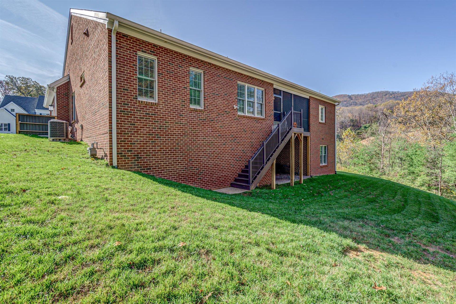 6989 Fairway Ridge Road Salem, VA 24153 - Photo 50 of 51 a backyard of a house with lots of green space