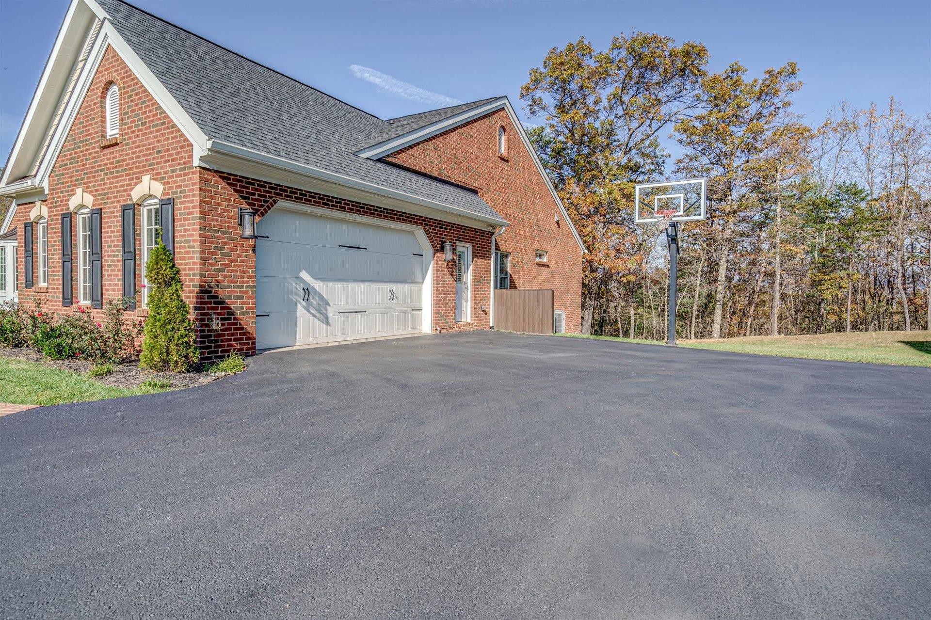 6989 Fairway Ridge Road Salem, VA 24153 - Photo 51 of 51 a front view of a house with a yard and garage