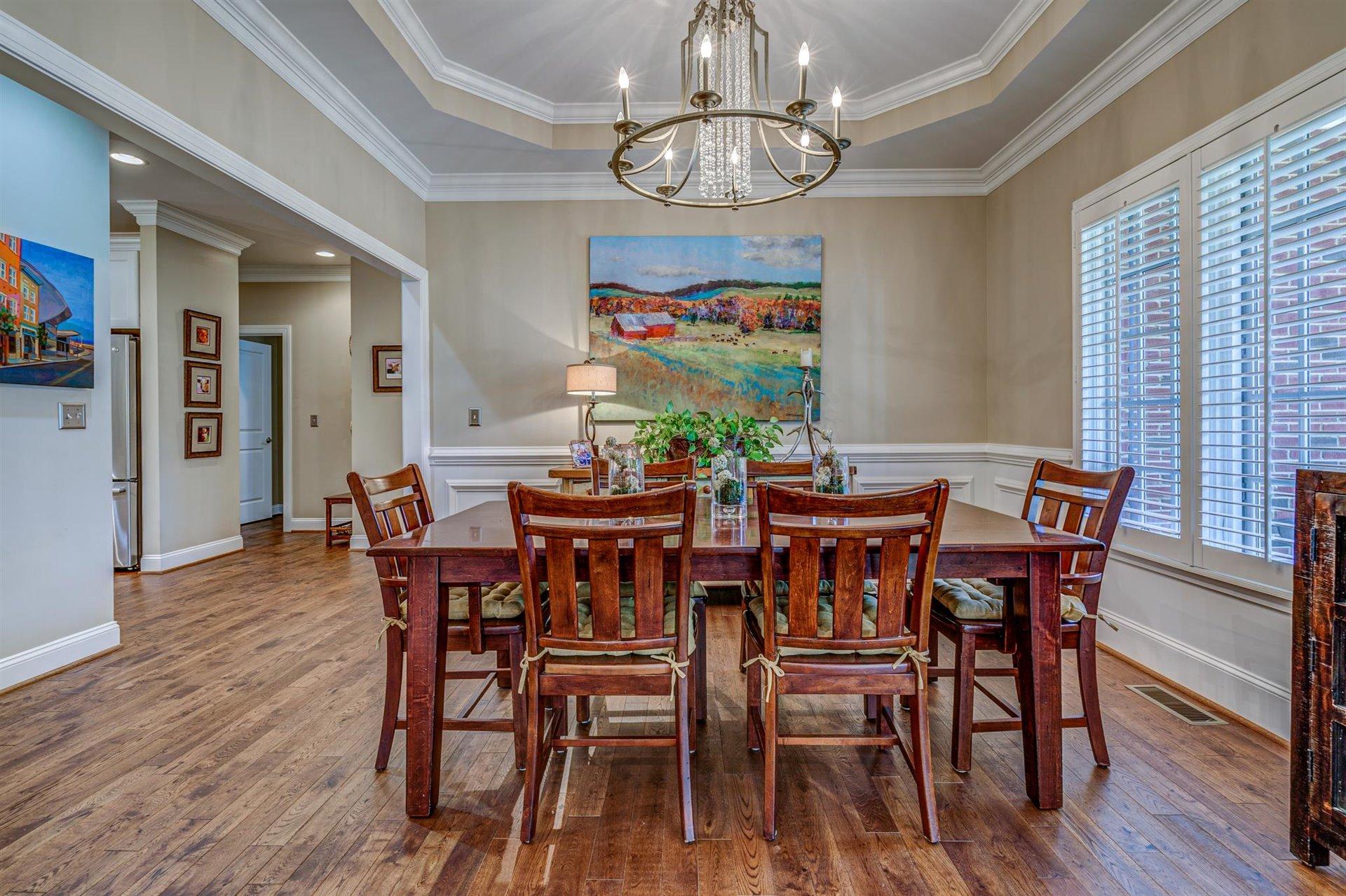 6989 Fairway Ridge Road Salem, VA 24153 - Photo 8 of 51 a view of a dining room with furniture wooden floor and chandelier