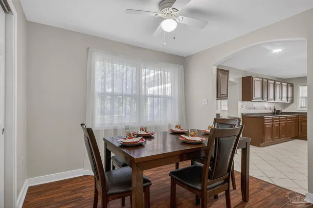 a kitchen with stainless steel appliances granite countertop a stove sink and cabinets