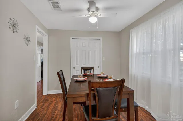 a kitchen with granite countertop a refrigerator and a sink