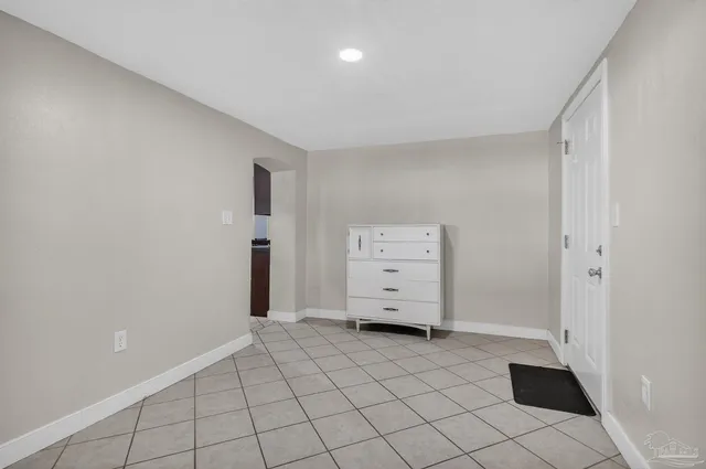 a backyard of a house with large trees