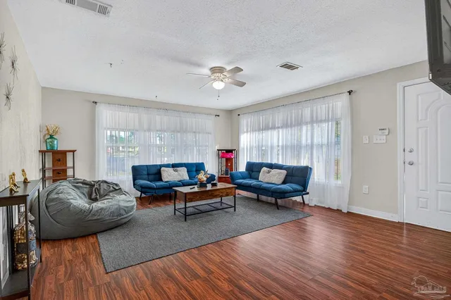 a living room with furniture and a large window