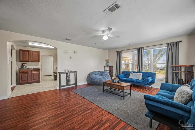 a view of a hallway view with wooden floor and staircase