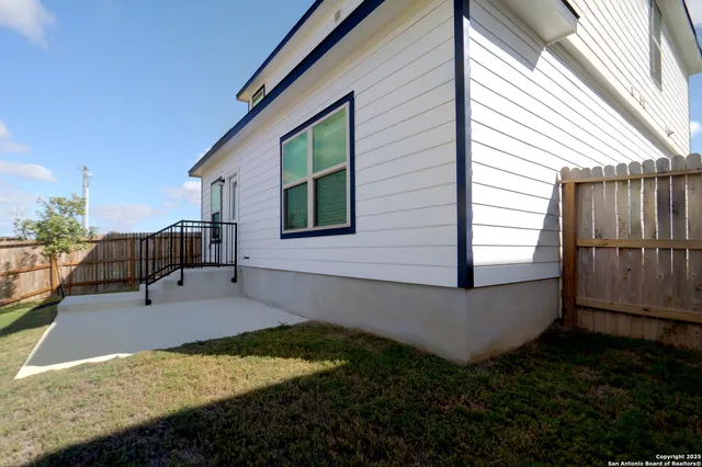 a swimming pool view with a garden