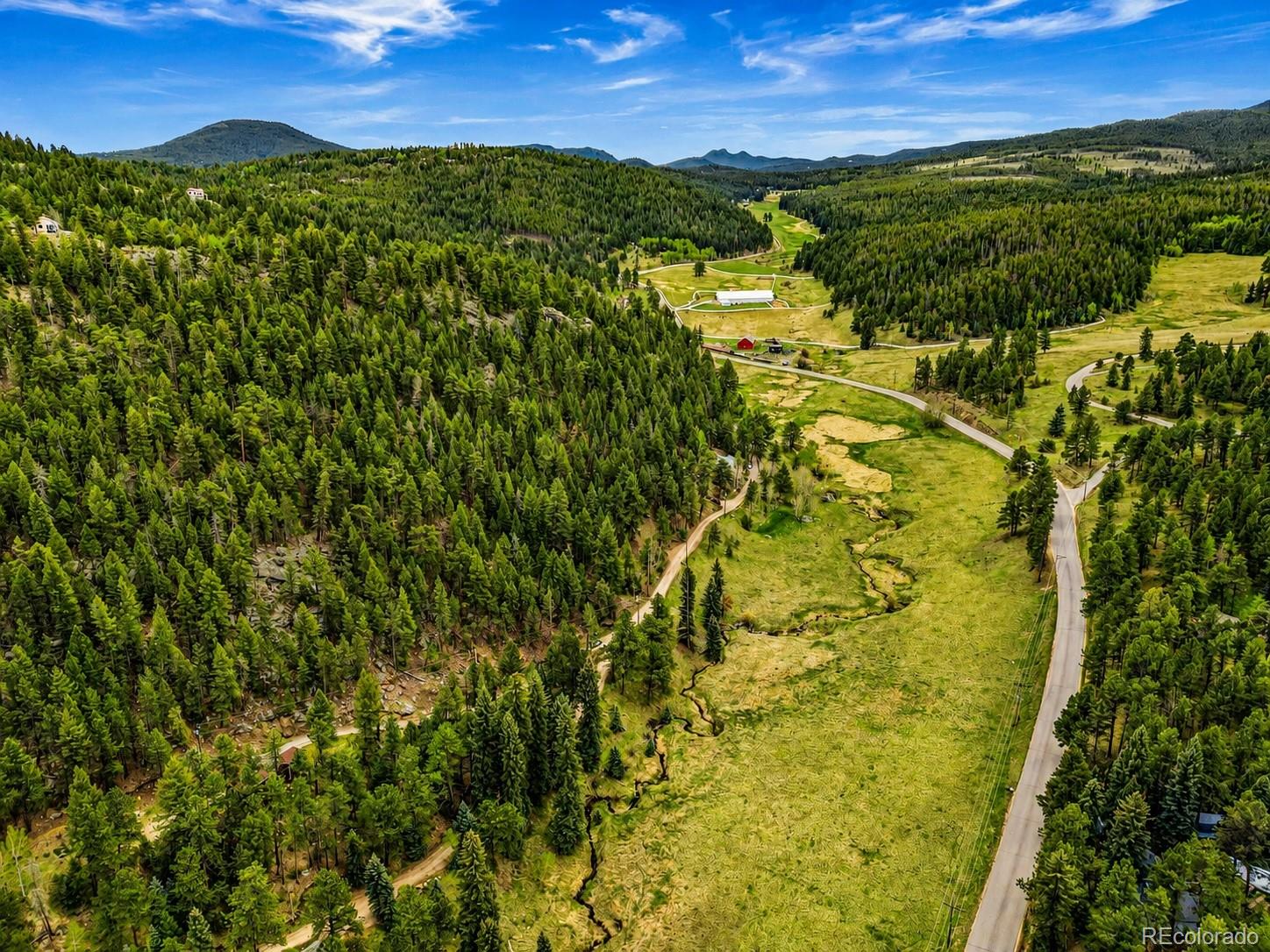 7520 South Blue Creek Road Evergreen, CO 80439 - Photo 20 of 22 a view of a city