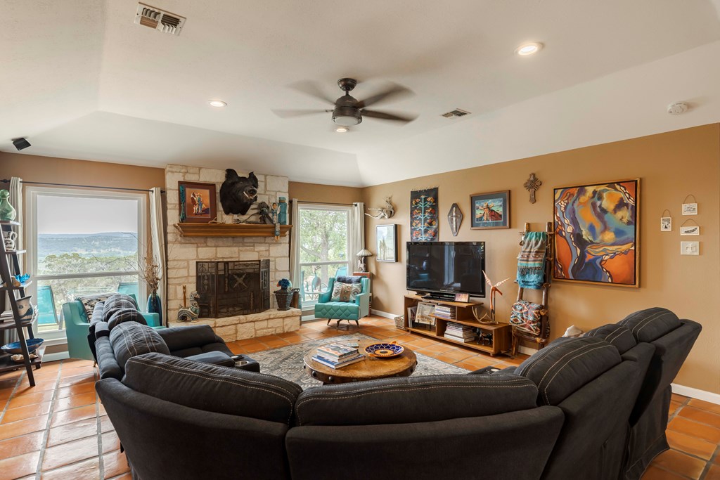 116 Ridge Road West Ingram, TX 78025 - Photo 13 of 65 a living room with fireplace furniture and a flat screen tv