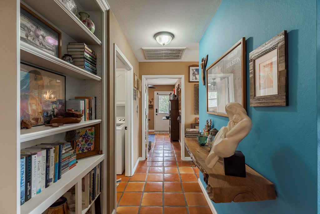 116 Ridge Road West Ingram, TX 78025 - Photo 20 of 65 a hallway with dining table and chairs