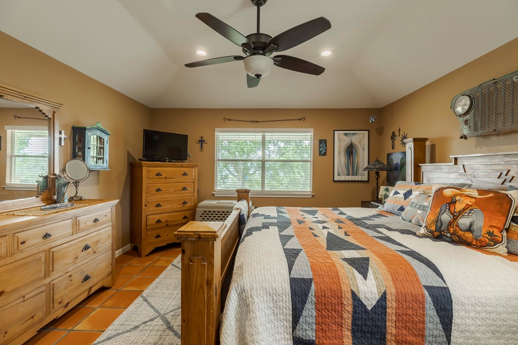 116 Ridge Road West Ingram, TX 78025 - Photo 22 of 65 a bedroom with a bed and a dresser