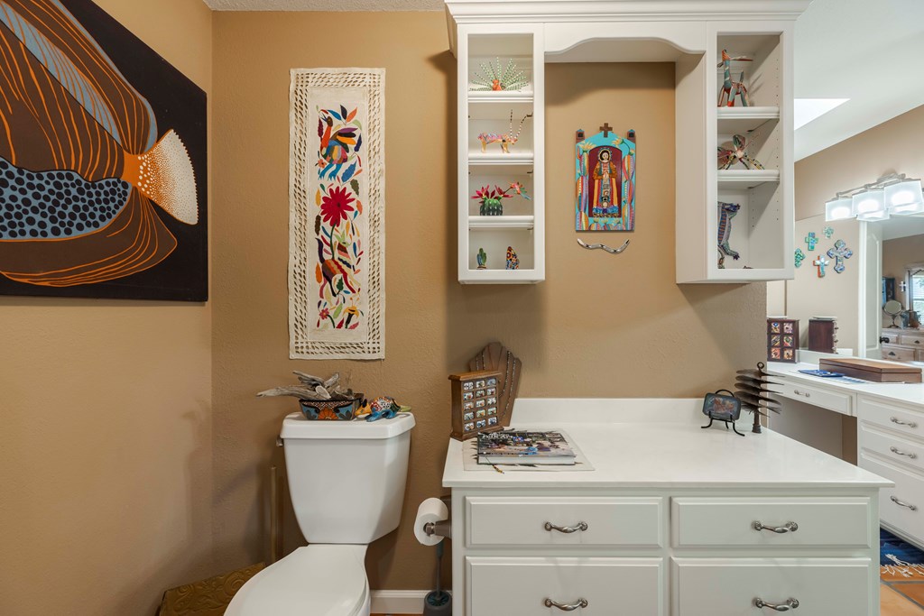 116 Ridge Road West Ingram, TX 78025 - Photo 27 of 65 a bathroom with a toilet a sink and mirror