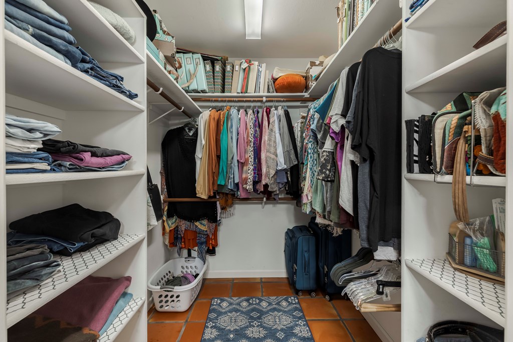 116 Ridge Road West Ingram, TX 78025 - Photo 28 of 65 a view of walk in closet with clothes and shoes