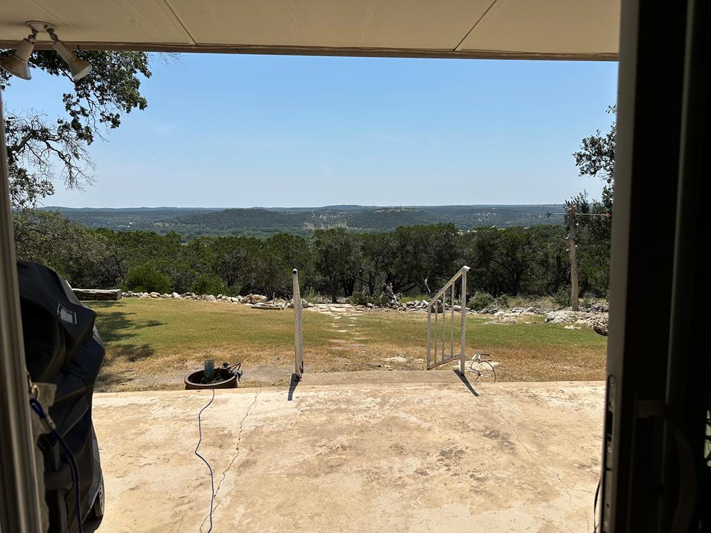116 Ridge Road West Ingram, TX 78025 - Photo 39 of 65 a view of a swimming pool with a yard
