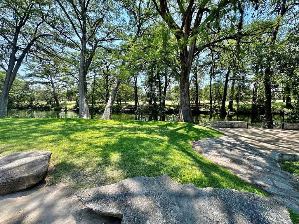 116 Ridge Road West Ingram, TX 78025 - Photo 57 of 65 a backyard of a house with lots of green space