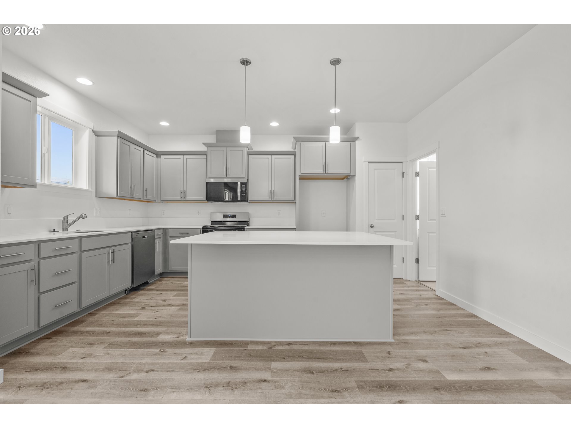 673 Parker Loop Silverton, OR 97381 - Photo 15 of 37 a view of kitchen with wooden floor